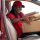 close up delivery person with parcels 80x80